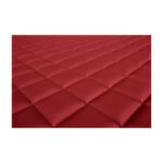 Superfície acolchoada vermelha em detalhe.